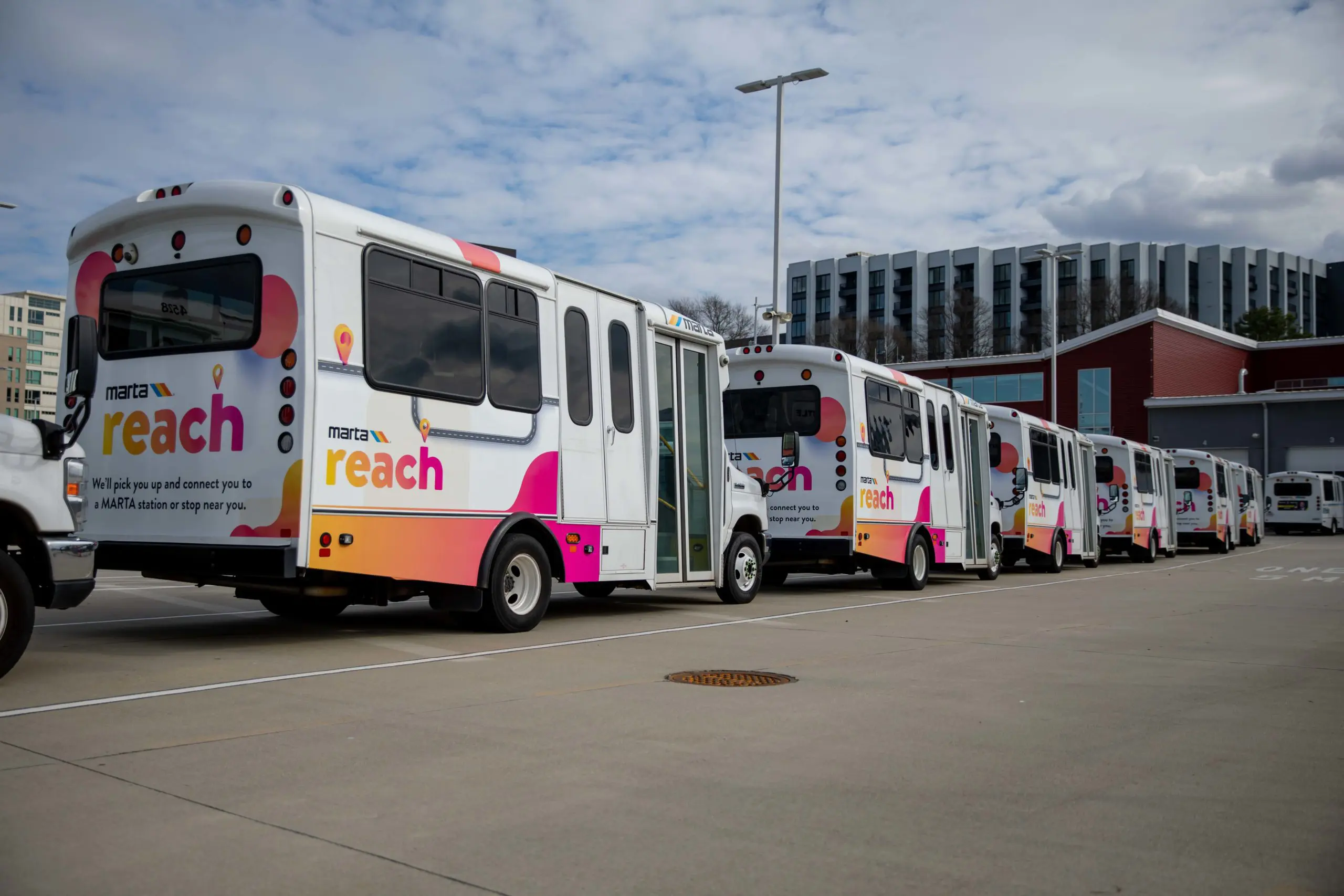 Fleet of MARTA buses parked outside in a line.