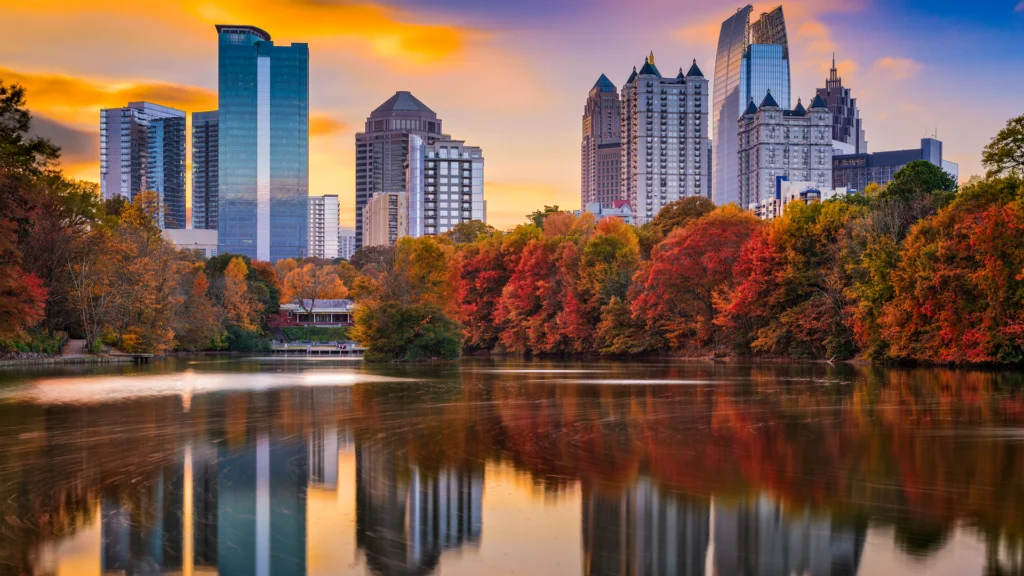 View of a pond that has the Atlanta skyline above it.