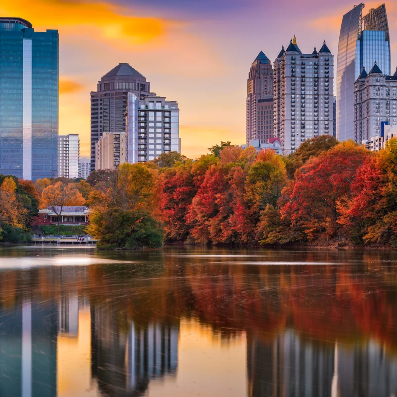 View of a pond that has the Atlanta skyline above it.