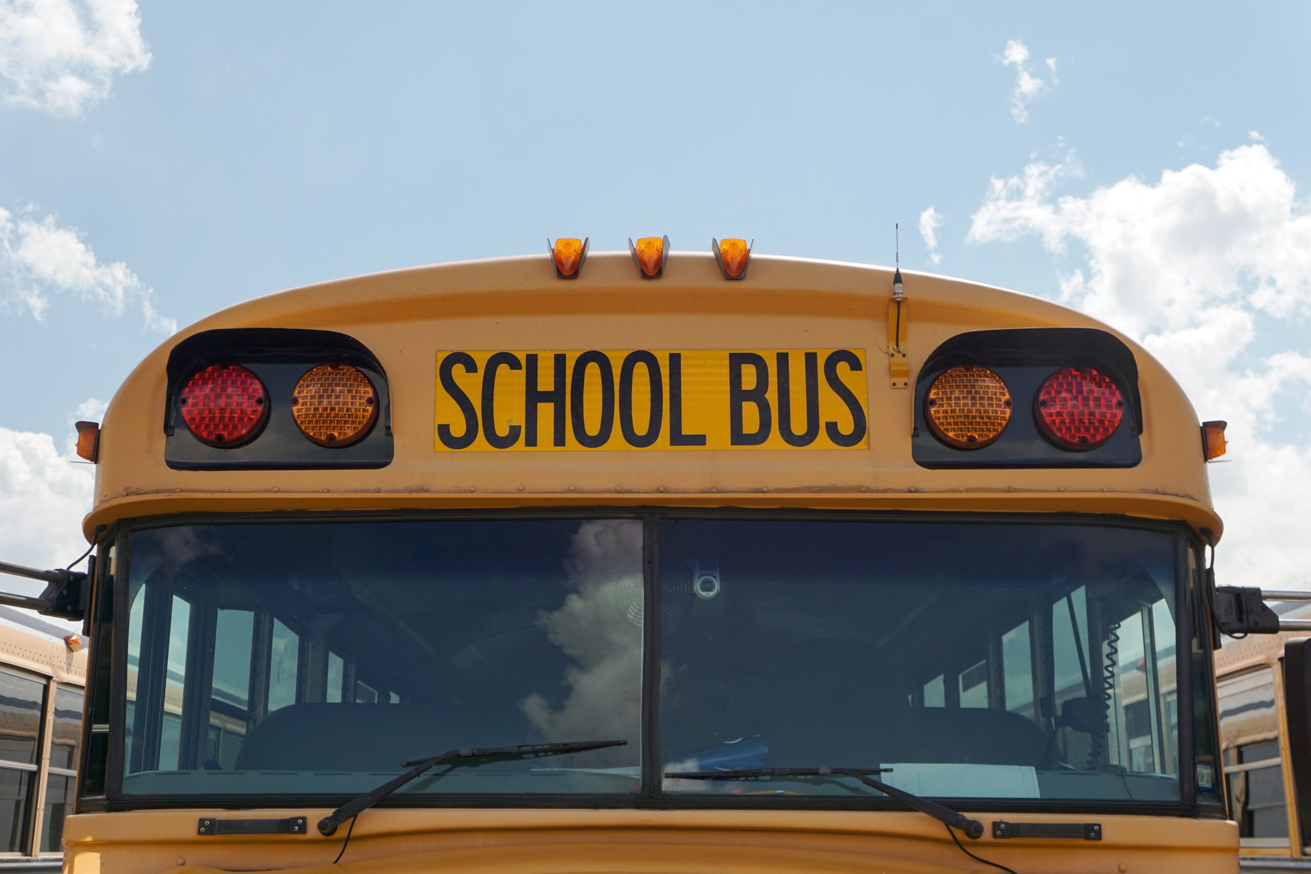 School bus in front of blue sky