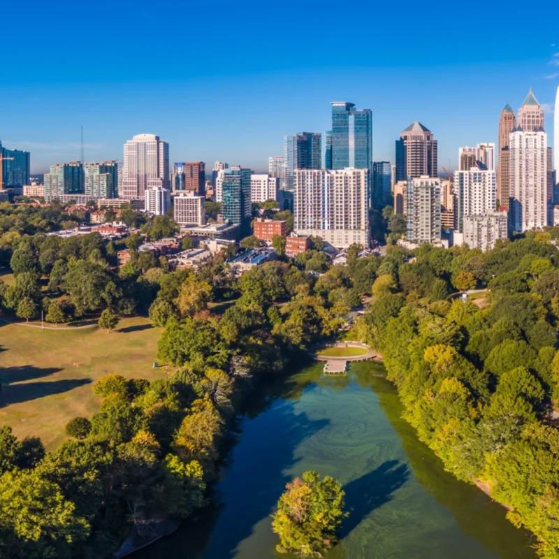 An image of the Atlanta skyline and a public park.