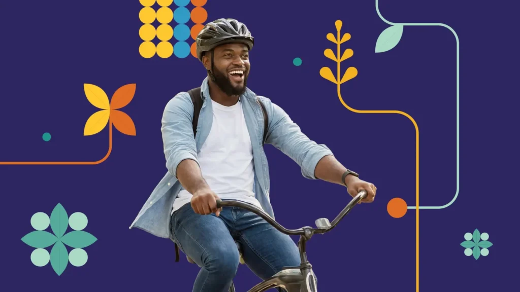 A smiling man wearing a helmet and backpack rides a bicycle against a dark blue background with colorful abstract shapes and leaves.